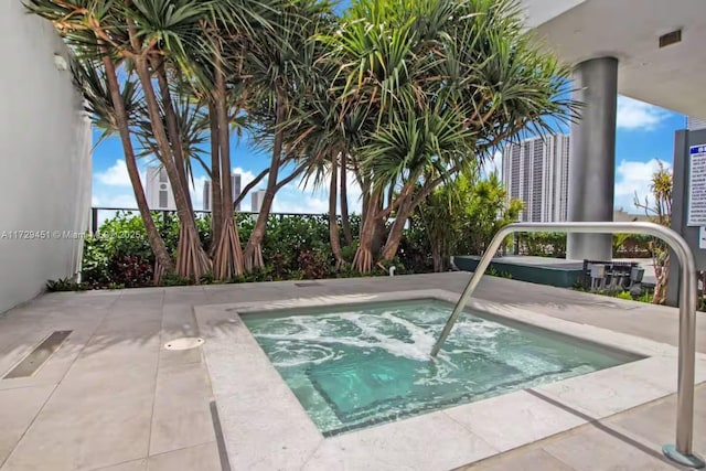 view of pool featuring a community hot tub