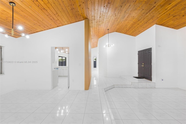 unfurnished room featuring high vaulted ceiling, light tile patterned floors, a notable chandelier, and wood ceiling