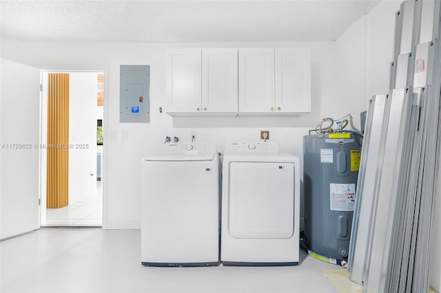 washroom featuring water heater, independent washer and dryer, a textured ceiling, cabinets, and electric panel