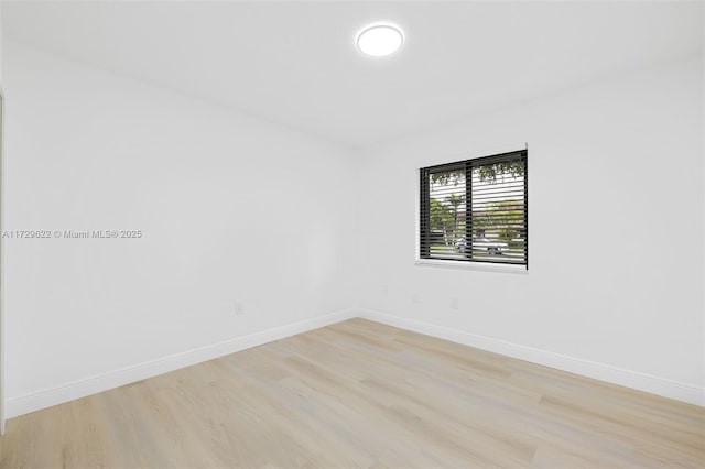 spare room featuring light hardwood / wood-style floors