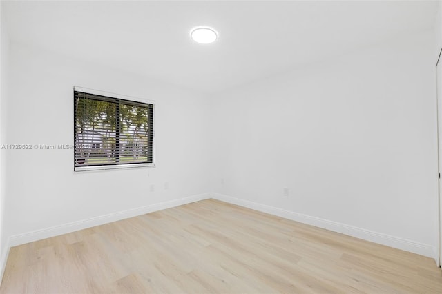 spare room featuring light hardwood / wood-style flooring