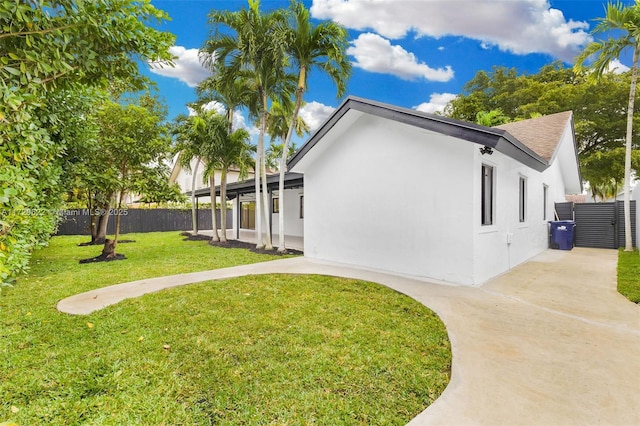 view of property exterior featuring a lawn