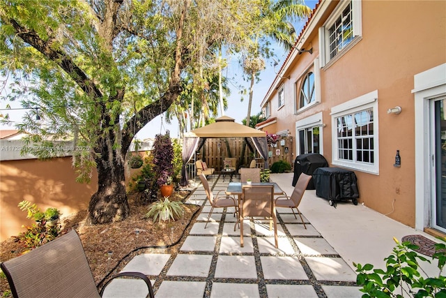 view of patio with a gazebo and a grill