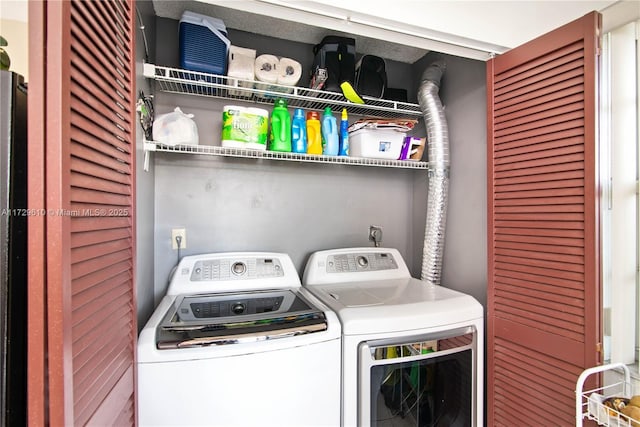 laundry room with washing machine and dryer