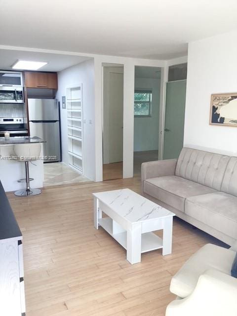 living room with light hardwood / wood-style flooring