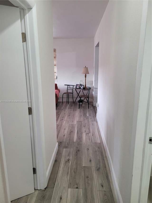 hallway featuring light hardwood / wood-style flooring