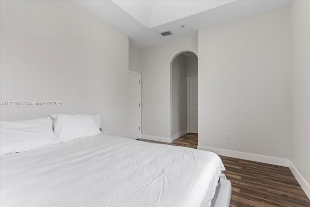 bedroom featuring dark wood-type flooring