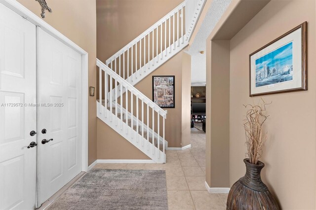 entrance foyer featuring light tile patterned flooring