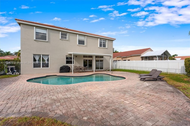 view of pool with central AC unit and a patio area