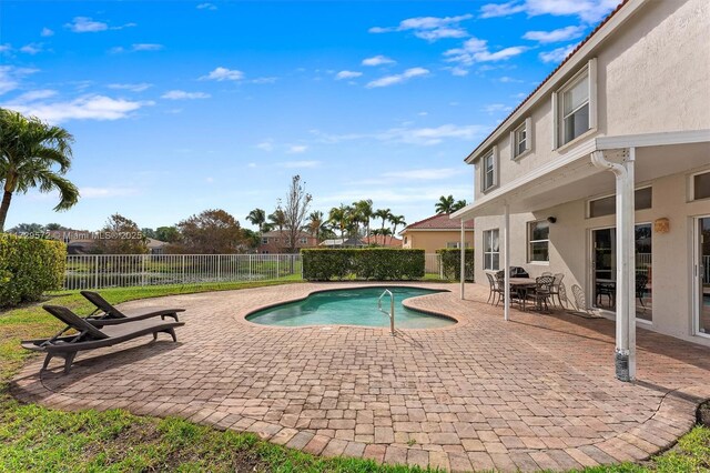 view of swimming pool with a patio area