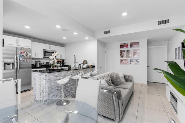 living room with light tile patterned flooring