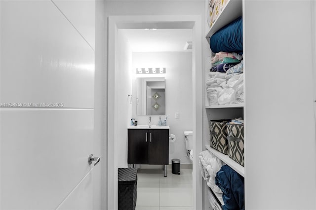 bathroom with tile patterned floors, toilet, and vanity