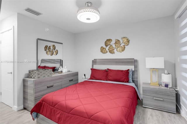 bedroom with light wood-type flooring