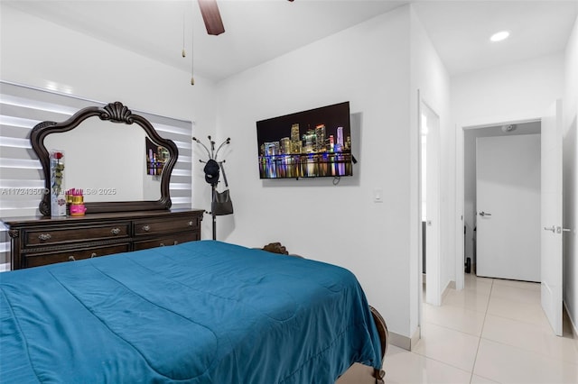 tiled bedroom featuring ceiling fan