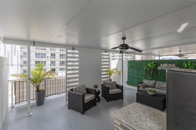 view of patio / terrace with ceiling fan and outdoor lounge area