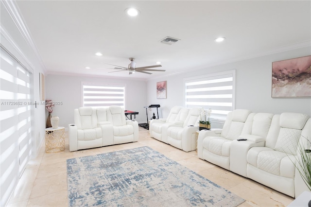 living room with crown molding, ceiling fan, and a wealth of natural light