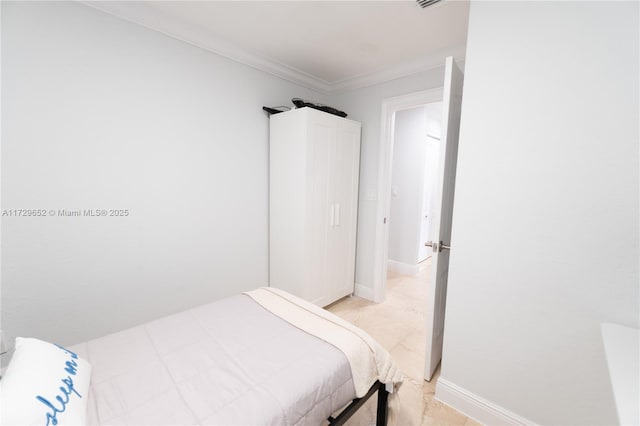 bedroom with ornamental molding