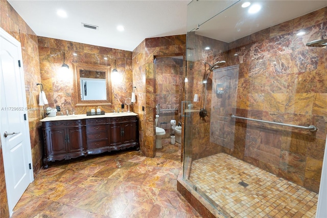 bathroom featuring a bidet, toilet, a shower with shower door, and tile walls