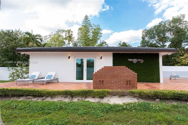 back of house featuring a patio and french doors