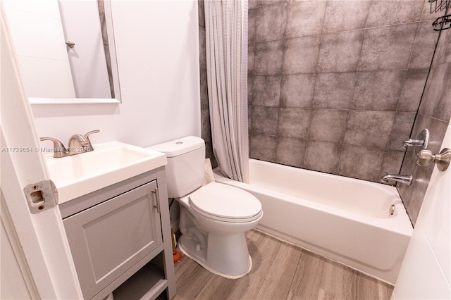 full bathroom featuring vanity, hardwood / wood-style floors, shower / bath combo, and toilet