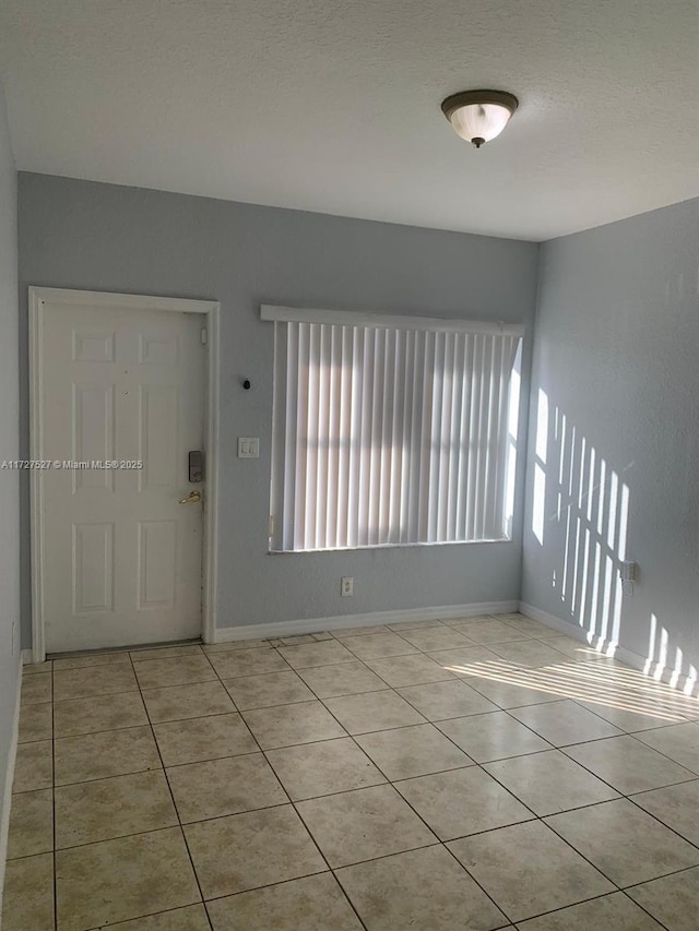 entrance foyer featuring light tile patterned flooring