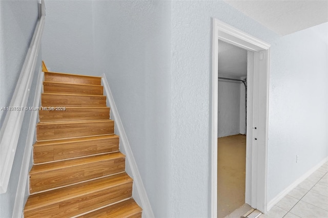 staircase with tile patterned flooring