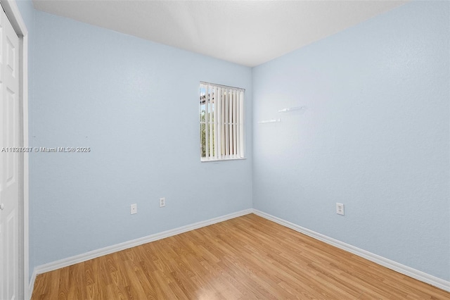 empty room featuring wood-type flooring