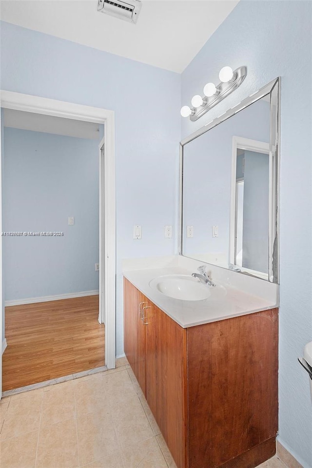 bathroom featuring vanity and tile patterned flooring