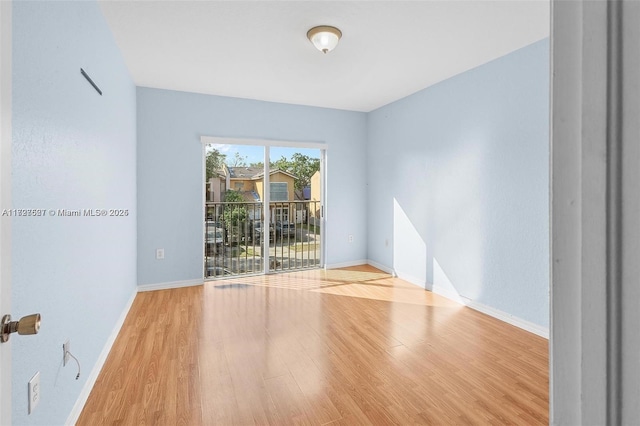 unfurnished room with light hardwood / wood-style floors