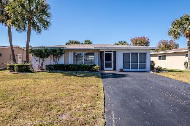 ranch-style home with a front yard