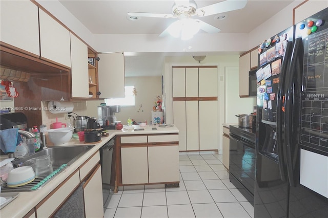 kitchen featuring light tile patterned flooring, white cabinetry, sink, ceiling fan, and black appliances