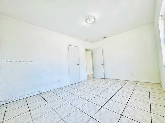 view of tiled spare room