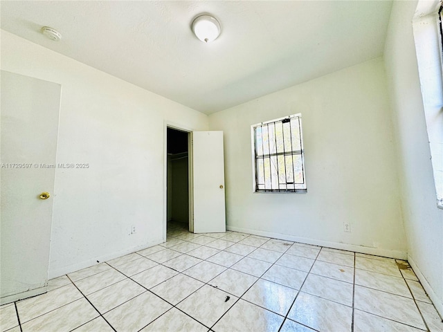 unfurnished bedroom with a closet