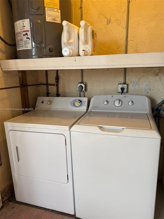 washroom with washing machine and clothes dryer