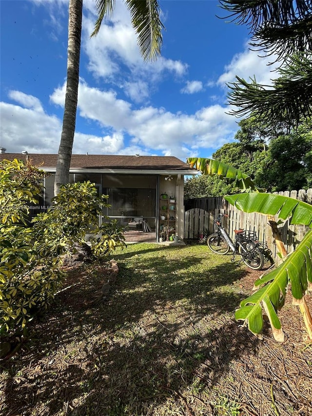 view of yard featuring a sunroom