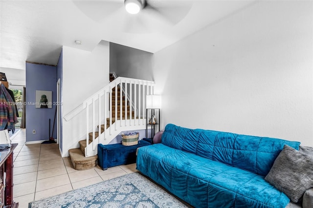 living room with ceiling fan and light tile patterned floors