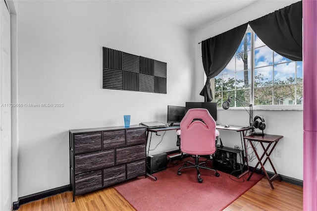 office area with light hardwood / wood-style floors