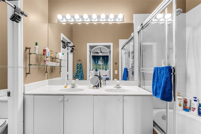 full bathroom with toilet, combined bath / shower with glass door, and vanity