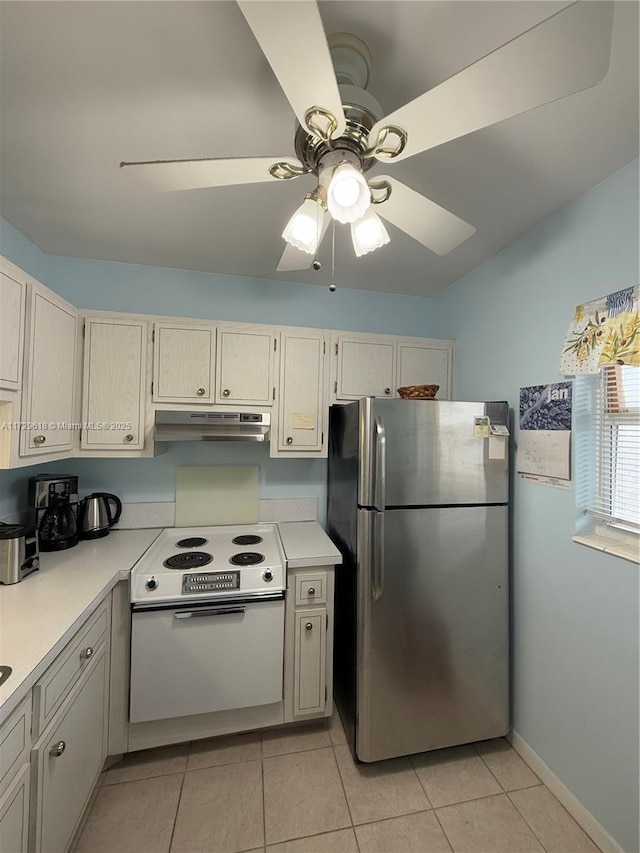 kitchen featuring ceiling fan, stainless steel fridge, white electric range oven, and light tile patterned flooring