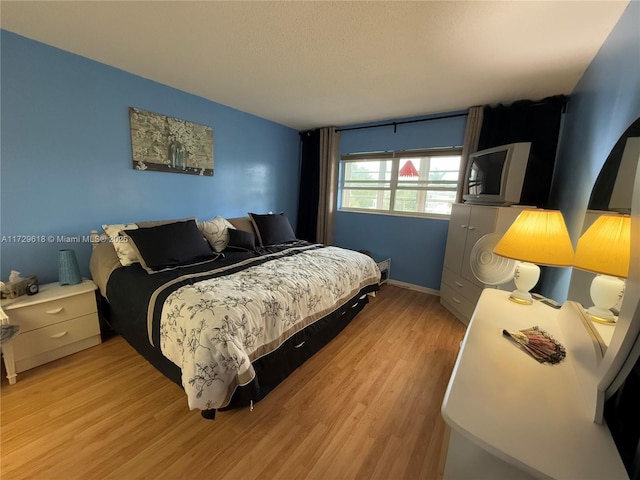 bedroom featuring light hardwood / wood-style flooring