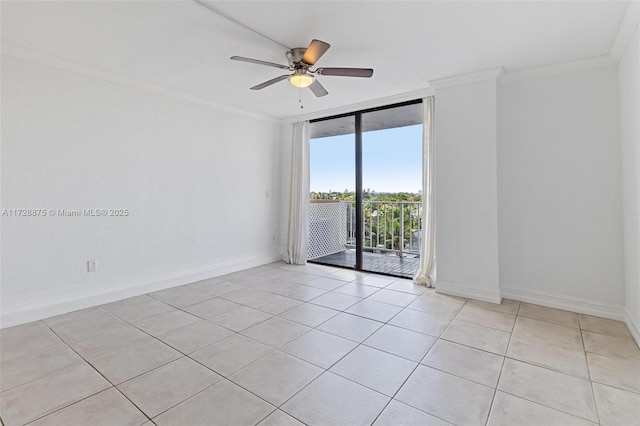 spare room featuring light tile patterned floors, ornamental molding, floor to ceiling windows, and ceiling fan