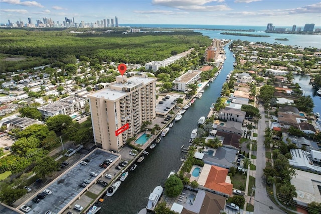 birds eye view of property featuring a water view