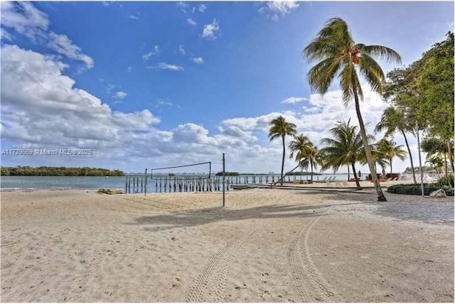 view of community with a water view and volleyball court