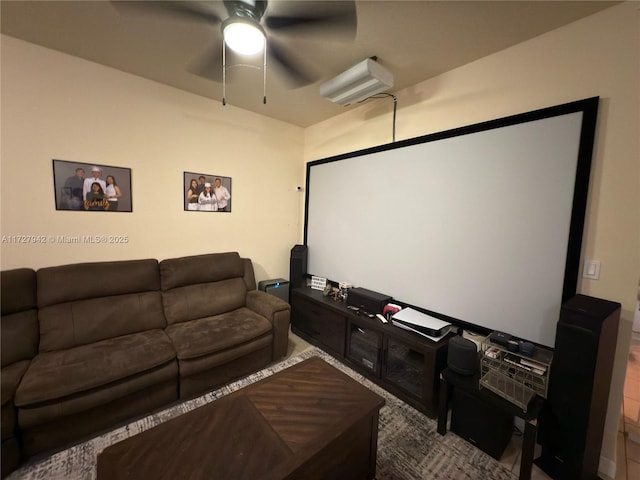 cinema room featuring ceiling fan and a wall mounted air conditioner