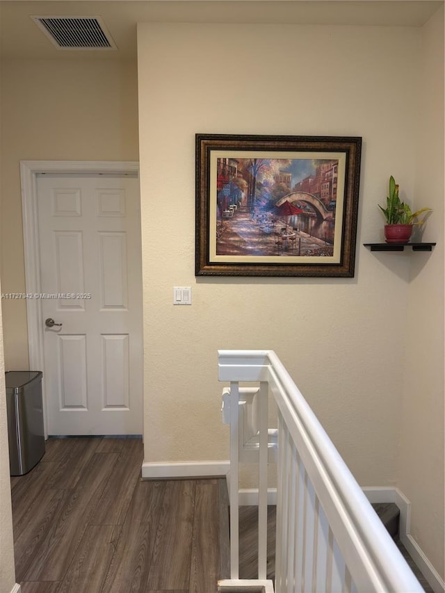 hallway with dark hardwood / wood-style floors