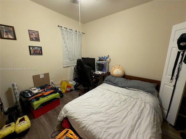 bedroom with wood-type flooring