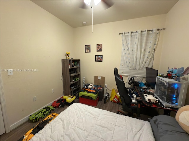 bedroom with ceiling fan and wood-type flooring