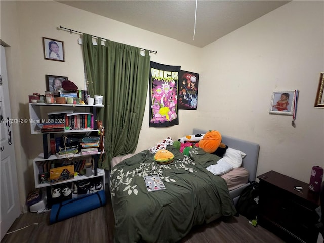 bedroom with wood-type flooring