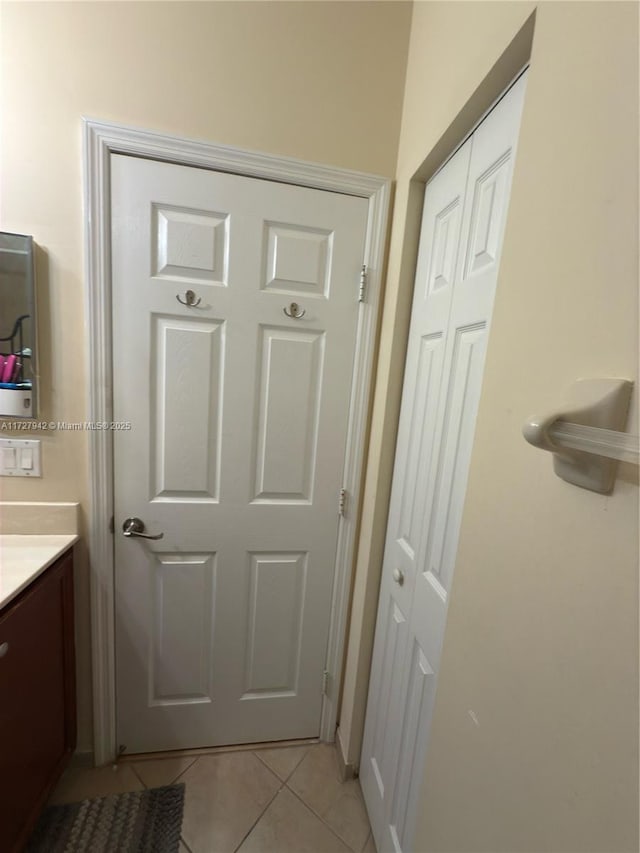 bathroom featuring vanity and tile patterned flooring