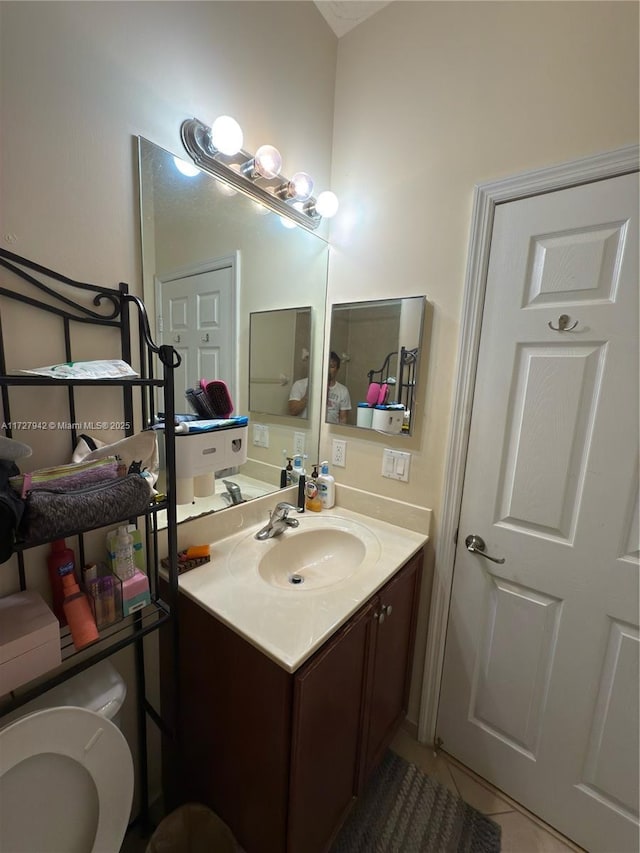 bathroom featuring tile patterned flooring and vanity